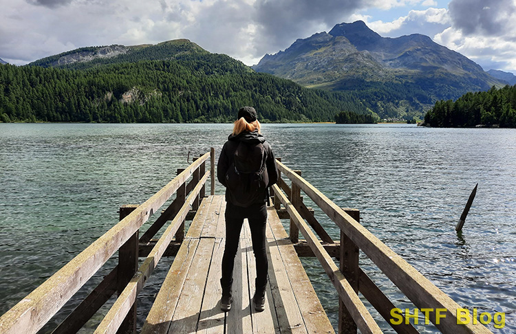 Outdoors woman looking out over a lake