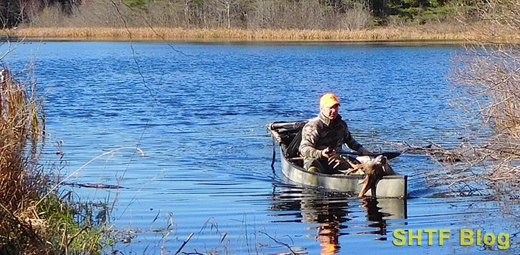 Remington 700 30-06 and a buck in a canoe