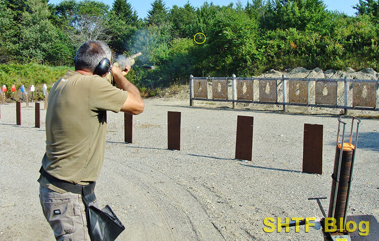 pointing at clay target for hit