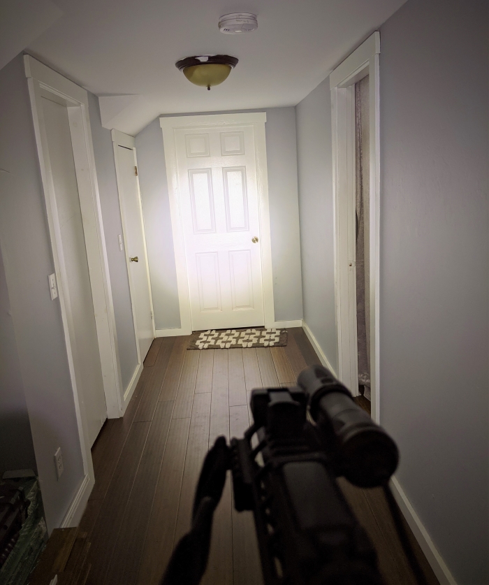 Olight Odin Mini down a darkened hallway