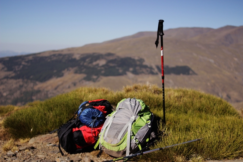 backpack and a walking stick