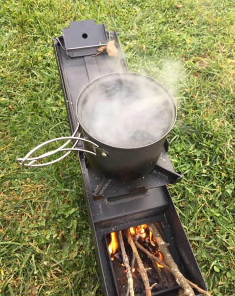 boiling water with an ammo can rocket stove