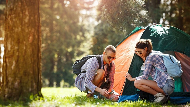 campers setting up tent