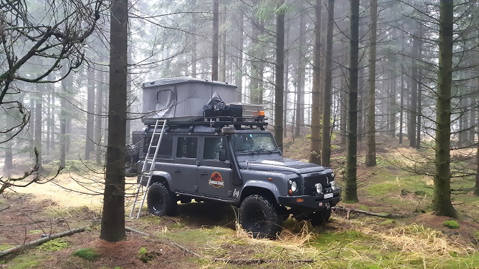 overlanding rooftop tent in forest