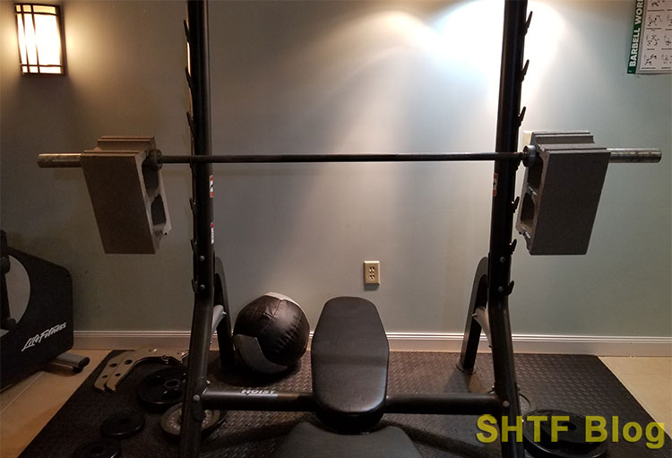 cinder block on barbell weight bench