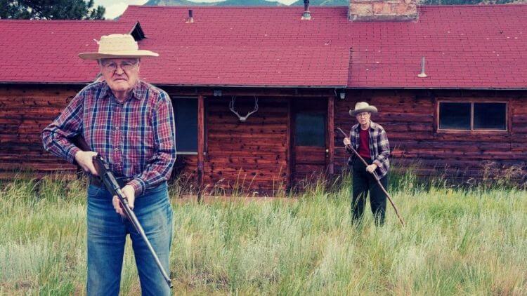 senior with gun protecting home