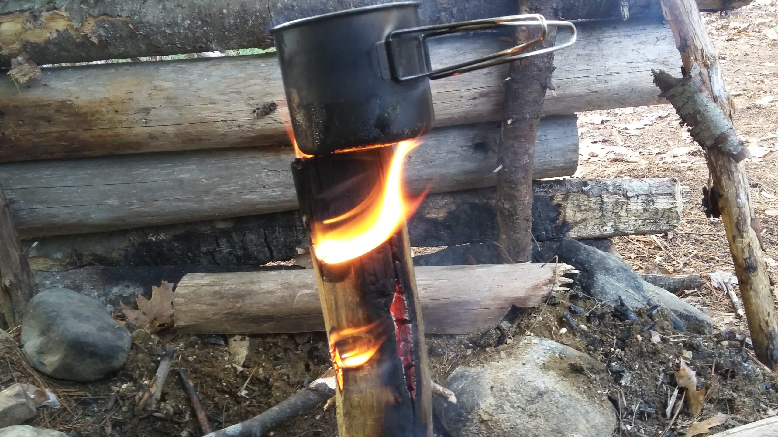 swedish torch boiling water in a pot